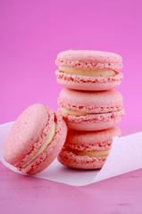 Strawberry flavor macaroons on pink background