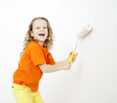 the girl with roller for paint repair
