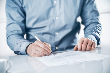 Businessman signing a contract or document