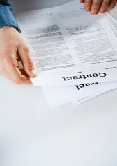 Fototapeta na wymiar Businessman reading through a contract