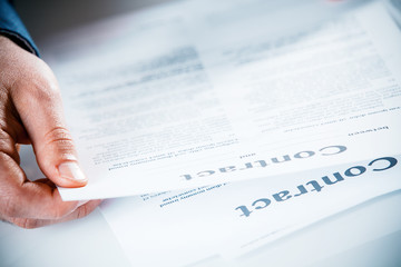 Businessman reading through a business contract