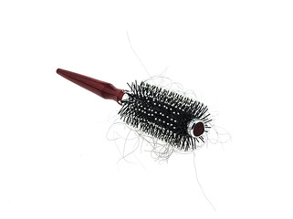 Hair loss problem with round hair brush , isolated on white back