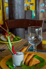 meat and vegetable samosas served in a small restaurant