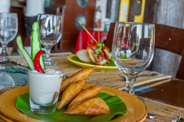 meat and vegetable samosas served in a small restaurant