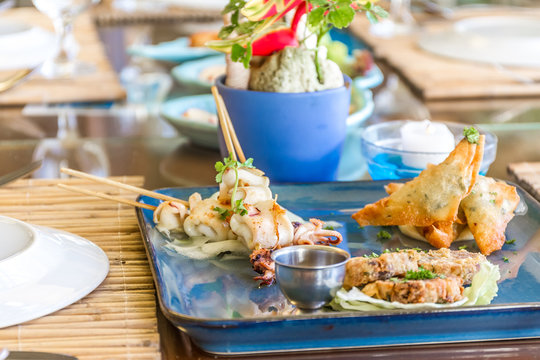 seafood snacks, calamaris, squid rings served in outdoor restaur