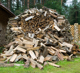 Stack of wood on a grass