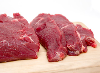 beef fillet on a board isolated on white background