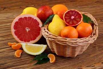 Obraz na płótnie Canvas Citrus fruits - oranges, lemons, tangerines, grapefruit