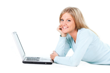 Naklejka premium Blonde girl working on laptop, white background