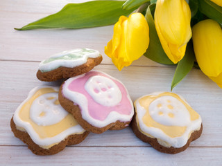 Easter flower shaped cookies and yellow tulips