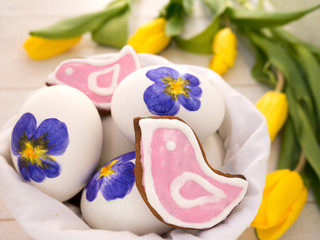 Painted Easter eggs and pink bird shaped cookies