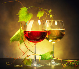 Two glasses of wine decorated with grape leaves