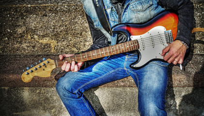 guitarist with a colorful guitar in hdr