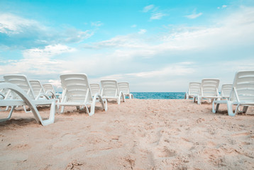 The sunbeds on the sea beach.