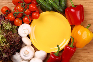 Empty plate and vegetables