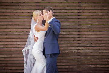 wedding on the background of wooden wall