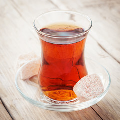 Tea in a transparent glass and Turkish Delight