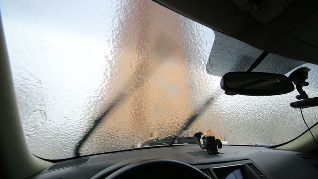 Inside view to crust of opaque ice on the outside car 