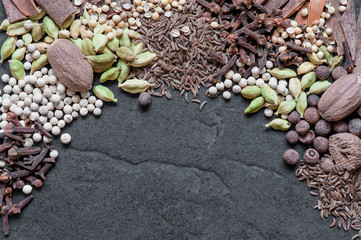 Various spices on the textured background
