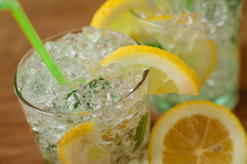 Lemonade with fresh lemon and mint by lemon reamer
