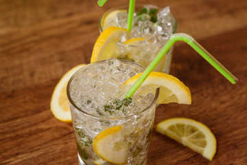 Lemonade with fresh lemon and mint by lemon reamer