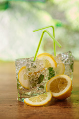 Lemonade with fresh lemon and mint by lemon reamer
