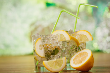 Lemonade with fresh lemon and mint by lemon reamer