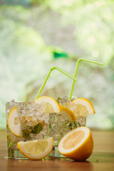 Lemonade with fresh lemon and mint by lemon reamer