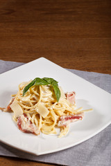 pasta carbonara on wood texture