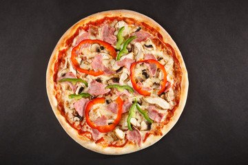 Tasty Italian pizza with mushrooms pepper hamon and chicken