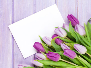 Purple tulip bouquet and blank greeting card