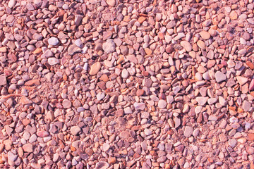 Pebble background at sun light.