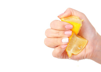 Female hand squeezing lemon isolated on white