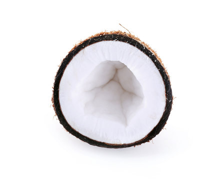 Coconut cut in half isolated on white background