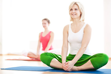 Two yogas woman indoors