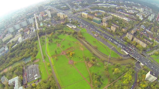 Day view: large modern city with small river, above view