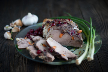 Pork meat with cranberry sauce and garlic