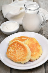 Fritters, sour cream and milk jug