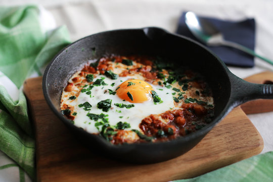 Poached egg in tomato sauce and spices, arabic shakshouka