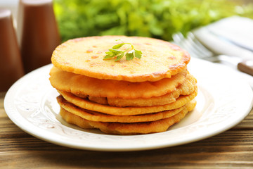 Stack of corn tortillas with stuffing and greens