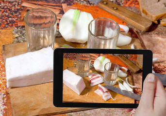 tourist photographs vodka, salty lard, fresh onion