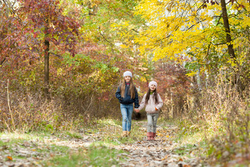 two girls walking in the woods