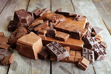 Set of chocolate on wooden table, closeup