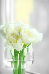 Beautiful spring flowers on windowsill background