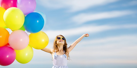 Fototapeta na wymiar happy girl with colorful balloons
