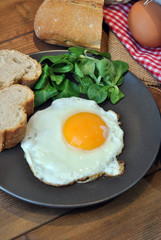 Fried eggs with bread and oil