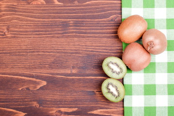 ripe delicious sliced kiwi on a board with a napkin
