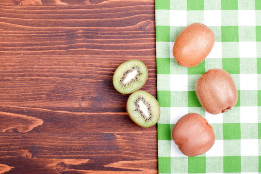 ripe delicious sliced kiwi on a board with a napkin