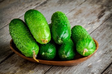 organic cucumbers in a wooden bowl