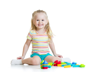 Portrait of sweet little girl with toy blocks